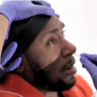 Mos Def Demonstrates Standard Guantánamo Bay Force-Feeding Practices [Video]